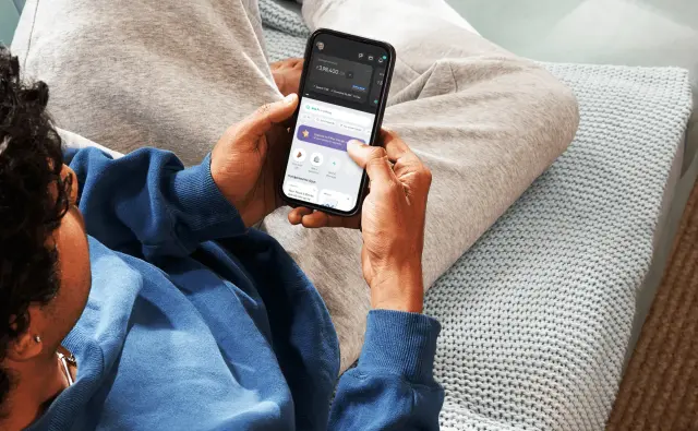 Person using Fi Money app on mobile